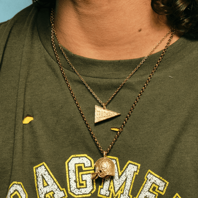 VARSITY FLAG PENDANT [GOLD] - FRAGMENT STUDIO