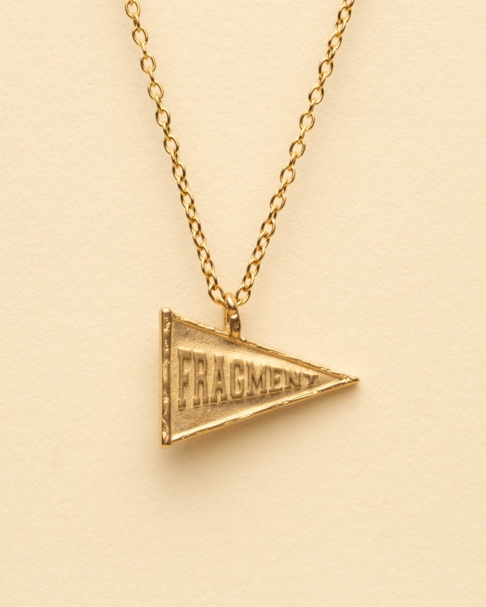 VARSITY FLAG PENDANT [GOLD] - FRAGMENT STUDIO