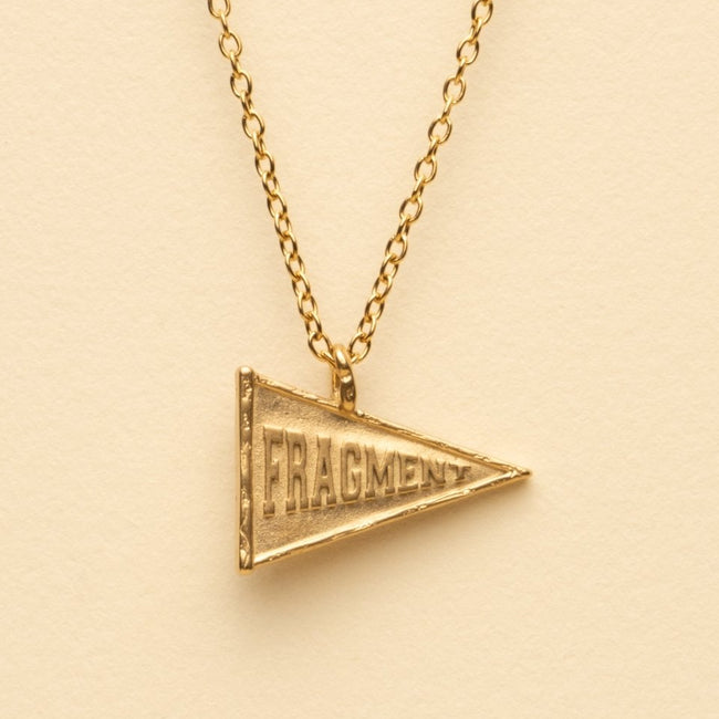 VARSITY FLAG PENDANT [GOLD] - FRAGMENT STUDIO